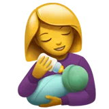 woman feeding baby