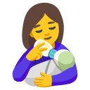 woman feeding baby